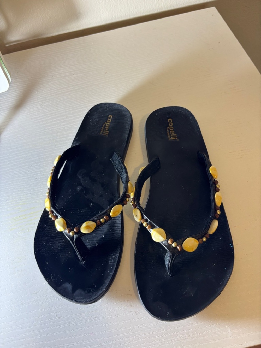 Capelli of New York Black Thong Sandals with Yellow Bead Accents
